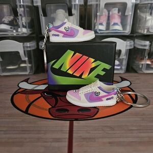 Nike SB pair of mini sneakers keychain.
